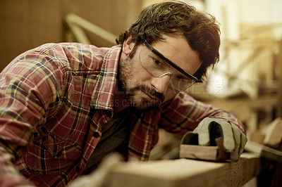 Buy stock photo Handyman, workshop and man with sanding for woodwork, furniture restoration and renovation. DIY project, factory and carpenter with timber, lumber or manufacturing for artisan craft or production