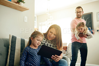 Buy stock photo Tablet, smile and mother with child on sofa for education app, streaming service and family support. Learning game, ebook subscription and alphabet cartoon with kids and parents in house together