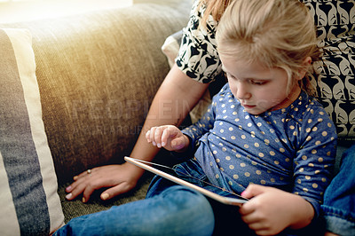Buy stock photo Tablet, relax and reading with child on sofa for education app, streaming service and research. Learning game, ebook subscription and alphabet cartoon with kid in living room of family house for tech