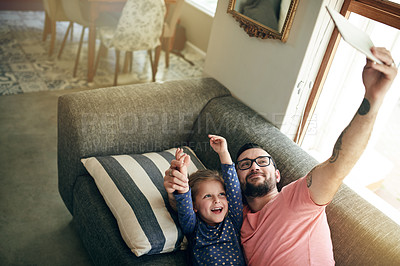 Buy stock photo Photography, selfie and dad with child on couch with tablet, cozy morning and family bonding for happy memory. Tech, mature man and excited daughter in home for profile picture, fun together or smile