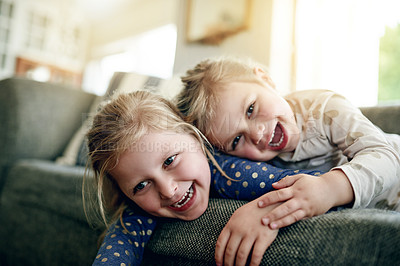 Buy stock photo Portrait, siblings and children on sofa, lounge and girls with smile on break, bonding and together. Happy, sisters and relax on couch, home and kids in living room, chill or family in apartment