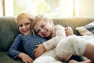 Buy stock photo Bonding, hug and portrait of girl children on sofa in living room of home together for morning love. Excited, family and smile with happy sister kids embracing in apartment for development or growth