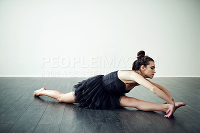 Buy stock photo Splits, stretching and woman on floor for ballet hobby, creative ballerina and training. Wall, white background or flexible dancer in studio with elegance, space or warm up for exercise or routine