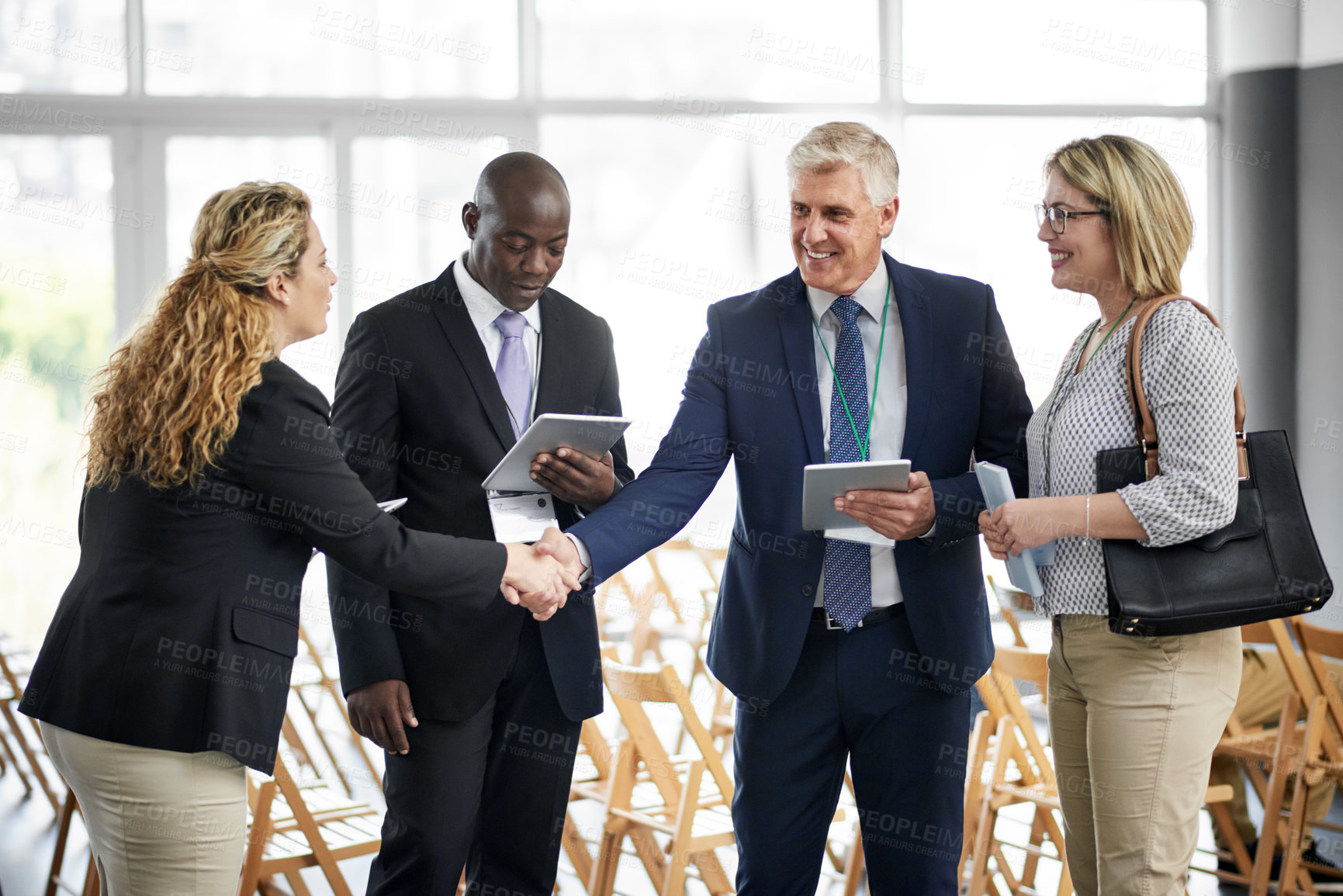 Buy stock photo Businessman, tablet and handshake for networking at convention with app, introduction and woman for meeting. People, exchange contact and tech with hello, smile or chat at international conference