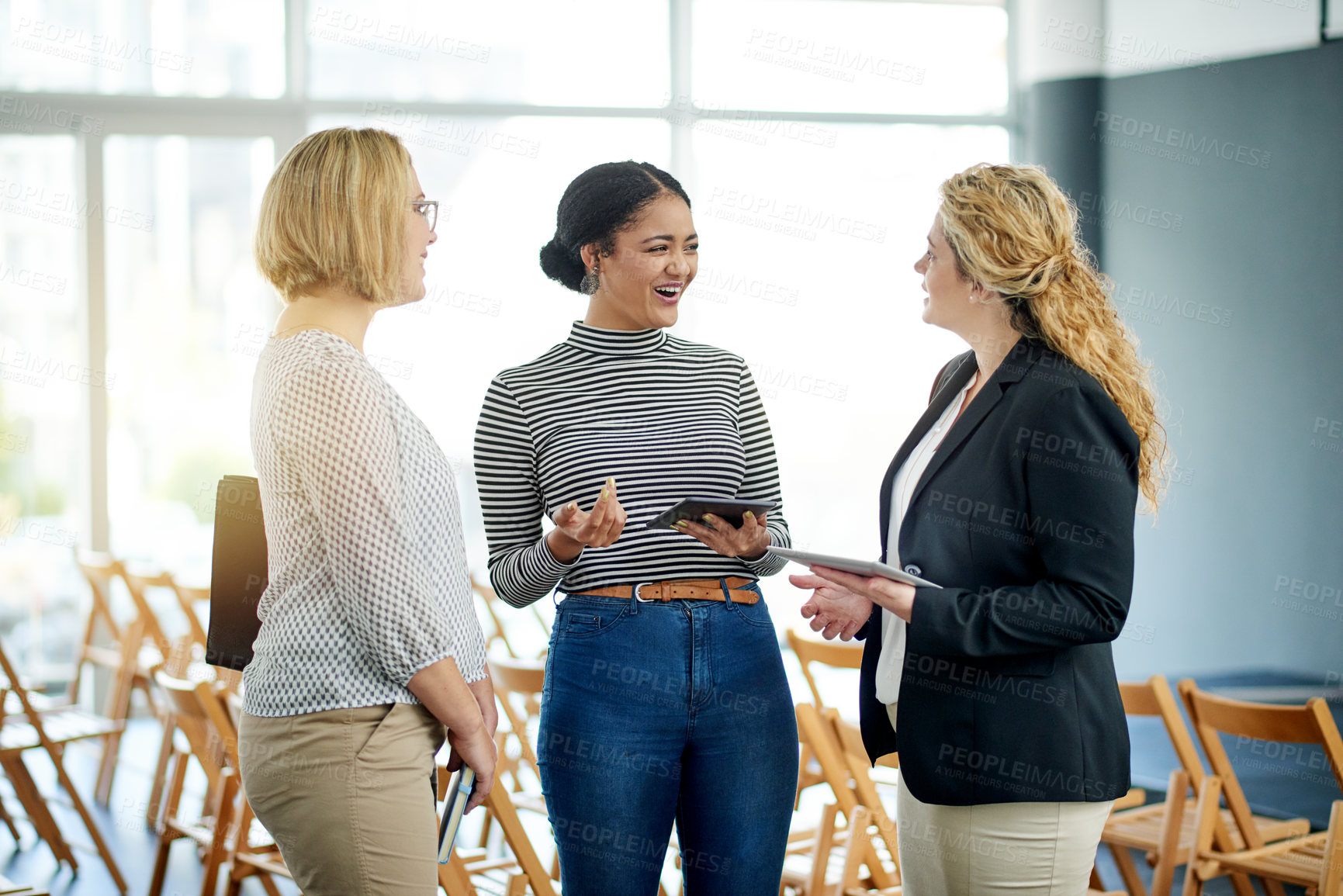 Buy stock photo Business women, laugh and team at conference for insurance, planning and tablet. Collaboration, seminar and conversation with tech at workshop for development, policy ideas and funny joke in office
