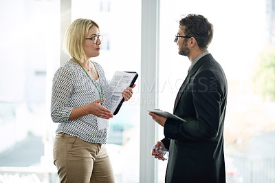 Buy stock photo Communication, manager or employee at window with tablet for feedback, collaboration or project review. Digital app, discussion or business people in workplace with tech, teamwork or strategy meeting