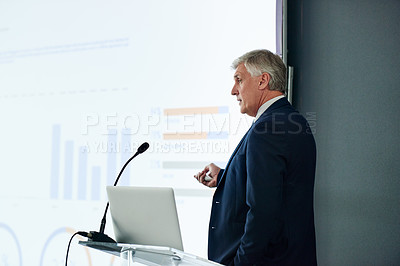 Buy stock photo Mature businessman, presentation and finance at seminar with charts, results and info at company. Person, leader and speaker on stage, projector and point with revenue announcement at conference