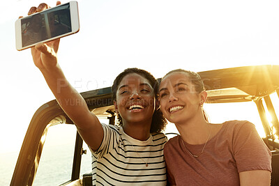 Buy stock photo Happy women, friends and car with selfie for picture, photography or road trip memory together. Female people, smile and capture moment with vehicle for outdoor travel, social media post or journey