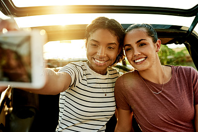 Buy stock photo Happy women, friends and car with selfie for memory, travel or road trip picture together. Female people, smile and capture moment with vehicle for outdoor photography, social media post or journey