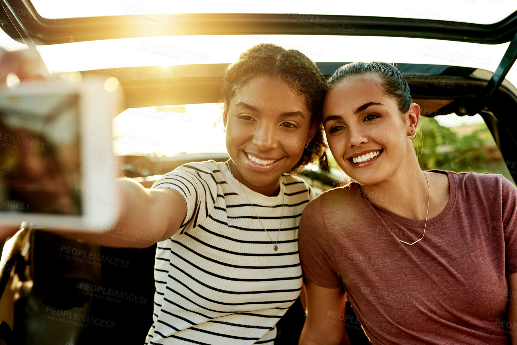 Buy stock photo Happy women, friends and car with selfie for memory, travel or road trip picture together. Female people, smile and capture moment with vehicle for outdoor photography, social media post or journey