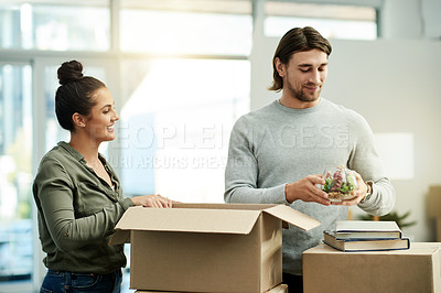 Buy stock photo Packing, boxes and couple in new home for moving, relocation and purchase property. Real estate, relationship and man with woman in apartment with package for rental agreement, mortgage and house