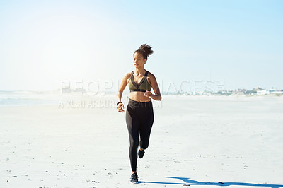 Buy stock photo Blue sky, fitness and running with woman on beach for cardio training or morning workout. Exercise, health and wellness with African athlete or runner on space outdoor for challenge or improvement