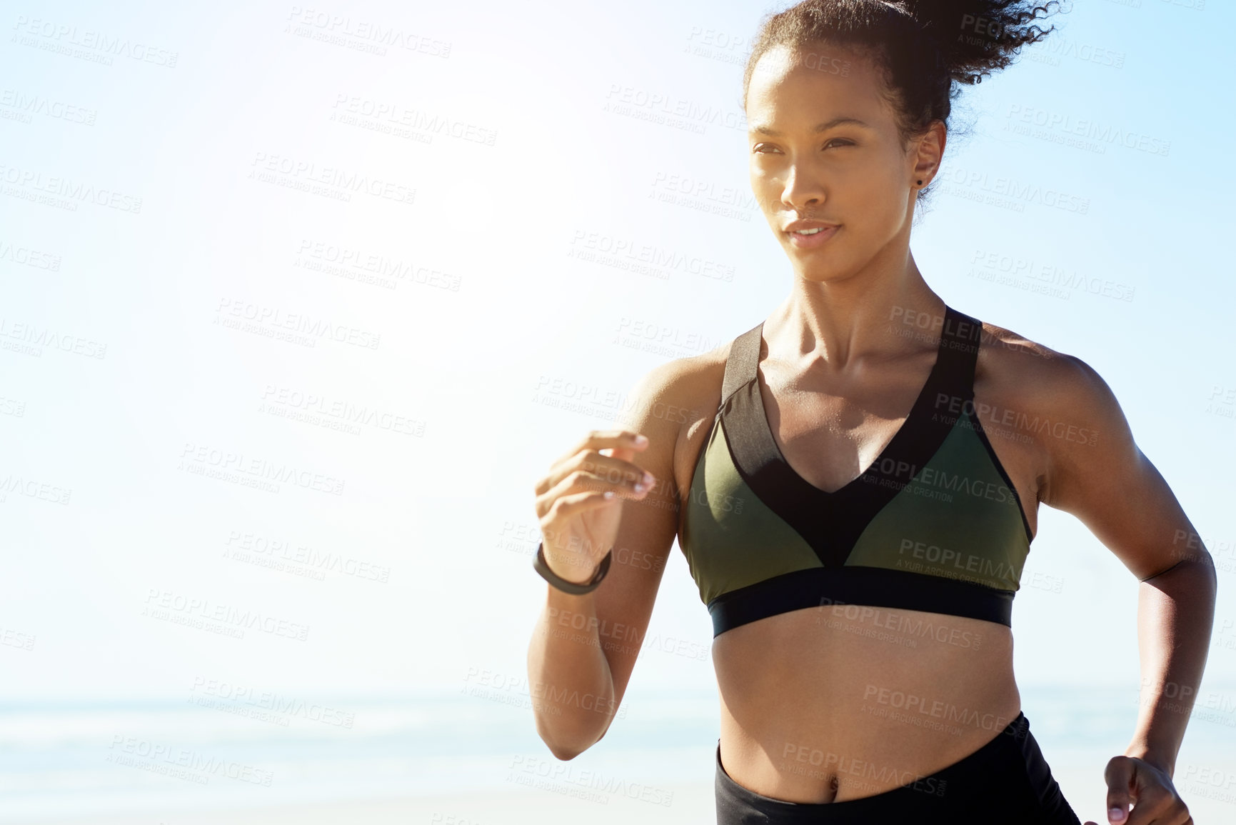 Buy stock photo Fitness, health and running with woman on beach for cardio training or morning workout. Blue sky, exercise and wellness with African athlete or runner on space outdoor for challenge or improvement