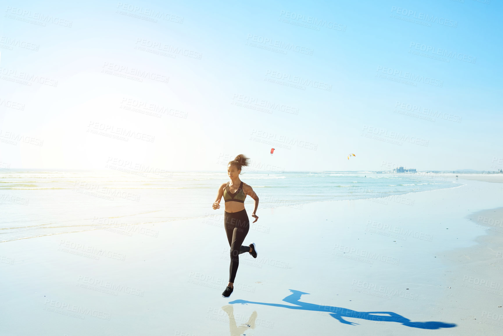 Buy stock photo Athlete, woman and run for fitness on beach for exercise, cardio training and endurance routine. Mockup space, person and jog with blue sky, sports workout and marathon practice on ocean for wellness