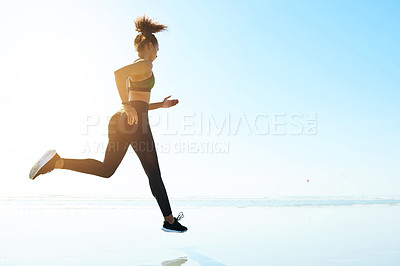 Buy stock photo Fitness, woman and running by sea for exercise, body wellness and health with mockup space. Beach, runner and cardio workout outdoor for endurance challenge, training and sports with flare in nature