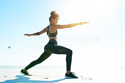 Buy stock photo Woman, fitness and beach with yoga for exercise, mindfulness or spiritual balance on space. Active, female person or yogi in warrior pose with flare on ocean coast for zen, flexibility or health