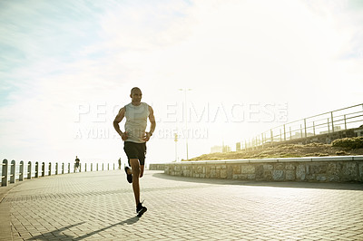 Buy stock photo Black man, fitness and running with sky for workout, exercise or cardio training on promenade. Active, male person or runner with sports or space for outdoor marathon challenge, health and wellness
