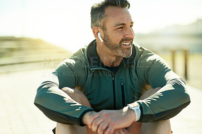 Buy stock photo Happy man, thinking or exercise break for outdoor running, fitness workout or cardio training. Recovery, music playlist or runner with earphones in practice for health, resting or sports performance