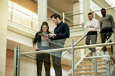 Buy stock photo Business people, tablet and discussion on stairway in office for finance report, advice and opinion. Below, financial advisor and mentor with digital app at work for investment solution and teamwork