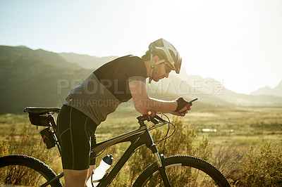 Buy stock photo Phone, research and bike with man in nature for location app, cycling route and social media post. Speed performance tracking, contact and bicycle with person outdoor for reading and direction search