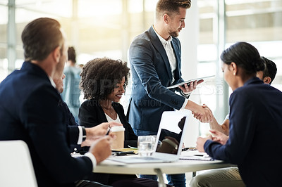 Buy stock photo Tablet, team and handshake with business people in meeting for investment, thank you or budget approval. Collaboration, treasury advisor or shaking hands with employees in office for account profit