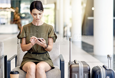 Buy stock photo Phone, travel and businesswoman waiting in airport lobby for networking event, summit and convention. Flight schedule, mobile and person with suitcase in lounge for international conference or app