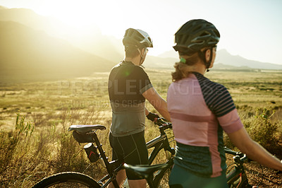 Buy stock photo Cycling, relax and view with couple in nature for workout break, fitness and bonding together. Wellness, triathlon training and resting stop with back of man and woman with bicycle outdoor for team