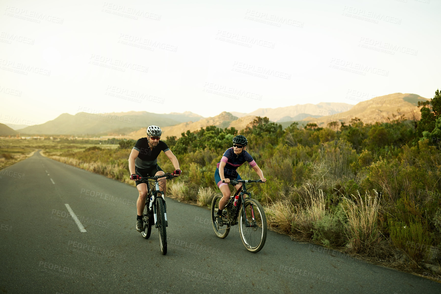 Buy stock photo Active, ride and couple with bicycle, nature or cycling for wellness, fitness and helmet for safety. Healthy, athlete and people with eco friendly transport, travel and adventure with bike or outdoor