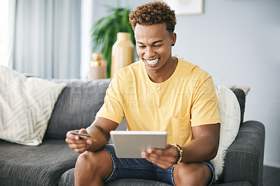 Buy stock photo Happy, student and tablet with credit card in home for college tuition, payment and subscription. Fintech, african man and smile with tech on sofa for university bill, online shopping and banking app