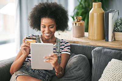 Buy stock photo Happy, online shopping and woman with tablet, home or card for digital purchase, payment and lounge. Rest, customer and African person with credit for discount, smile and tech for ecommerce in house