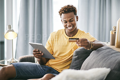 Buy stock photo Black man, tablet and excited on couch with credit card, sale or budget for online shopping in home. Person, happy and fintech app for discount, ecommerce and easy payment for banking on web at house