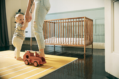 Buy stock photo Baby, mother and holding hands for learning to walk in home, education or growth. Development portrait, care and mama teaching kid or newborn first steps, helping with balance or support in nursery.
