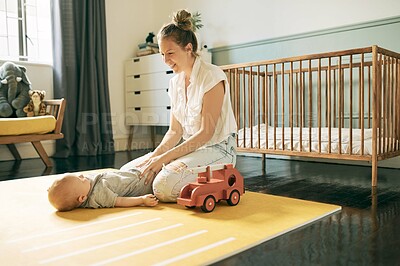 Buy stock photo Bond, happy and mother with baby playing in nursery, having fun and enjoy quality time together at home. Family love, growth and newborn child care of youth kid, mom and growing infant relax on floor