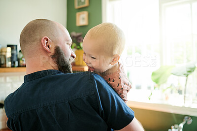 Buy stock photo Father, kid and single parent playing with a child in a kitchen at home laughing, smile and happy together. Bonding, dad and man person showing his baby happiness, care and support as way of love