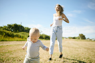 Buy stock photo Running, playing and mother with baby in a field for adventure, trip and bonding in nature. Love, games and woman with child in countryside, having fun together and learning to walk