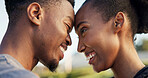 Black couple, smile and love outdoor with forehead touch for commitment, relationship and bonding. Happy, man and woman together for quality time, soulmate or romantic connection or support in summer