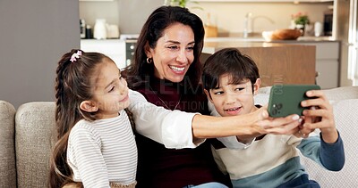 Buy stock photo Happy, mother and children in home with selfie, bonding and social media post for childhood memories. Woman, kids and smile in living room with photography, connection and family together on weekend.