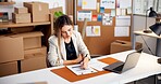 Woman, writing and logistics with documents for inventory checklist, schedule delivery or stock. Female person, entrepreneur and order list with paperwork for courier distribution or finance in store