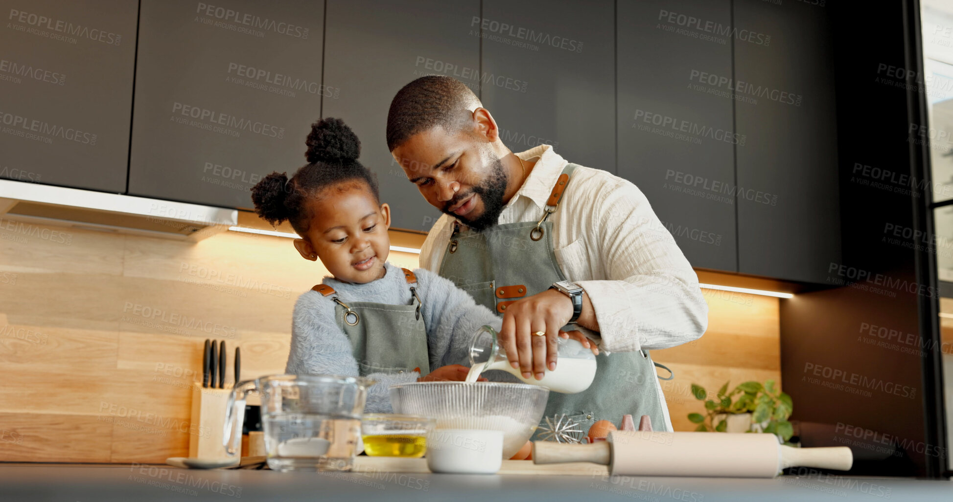 Buy stock photo Father, child and baking in kitchen with milk, teaching recipe and support with black family. Girl, parent and pour dairy for learning cooking in bowl, development and help with daughter at home