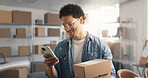 Ecommerce, man and phone in office with package, logistics and track online order on courier website. Happy, person and boxes with tech, supply chain and mobile app for reading distribution update.