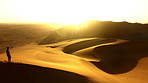 Walking through the vast Namibian desert