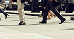 Group of people on their morning commute through a city street