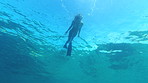 Woman swimming in the ocean