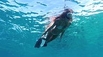 Woman swimming in the ocean