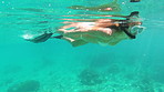 Woman swimming in the ocean