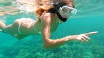 Woman swimming in the ocean