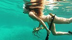 Woman swimming in the ocean