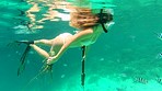 Woman swimming in the ocean