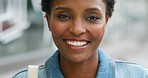 Headshot of a cheerful beautiful african woman laughing