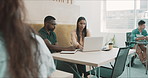 Diverse group of young businesspeople working in an office cafeteria lounge or break room. Ambitious colleagues having discussion while collaborating and planning ideas in a creative startup agency